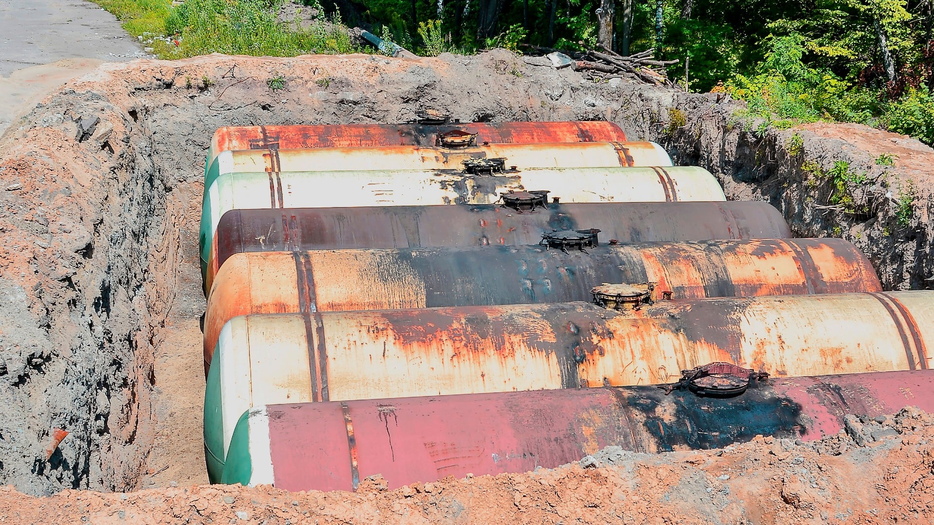 a large tank for gasoline in an excavated quarry for storage of petroleum products