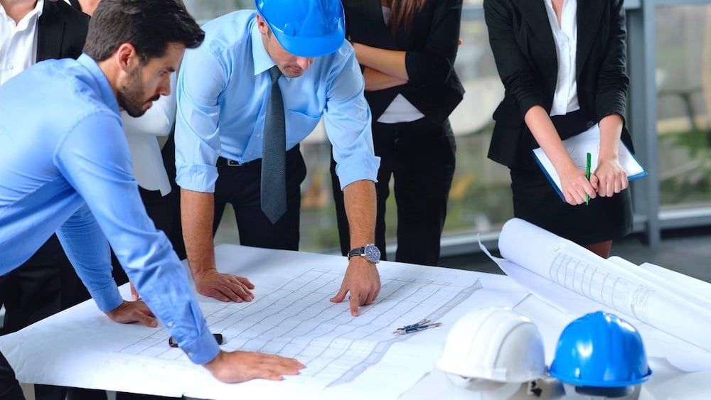 business people discuss construction project planning
