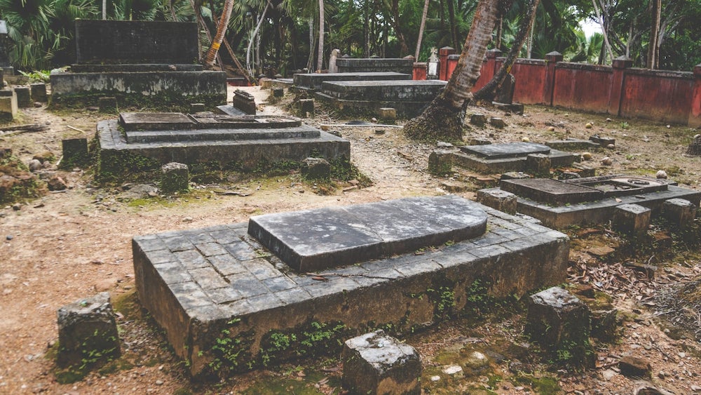 Old stone graves in cemetery | Can Cemeteries Tell You Where Someone Is Buried? | US Radar